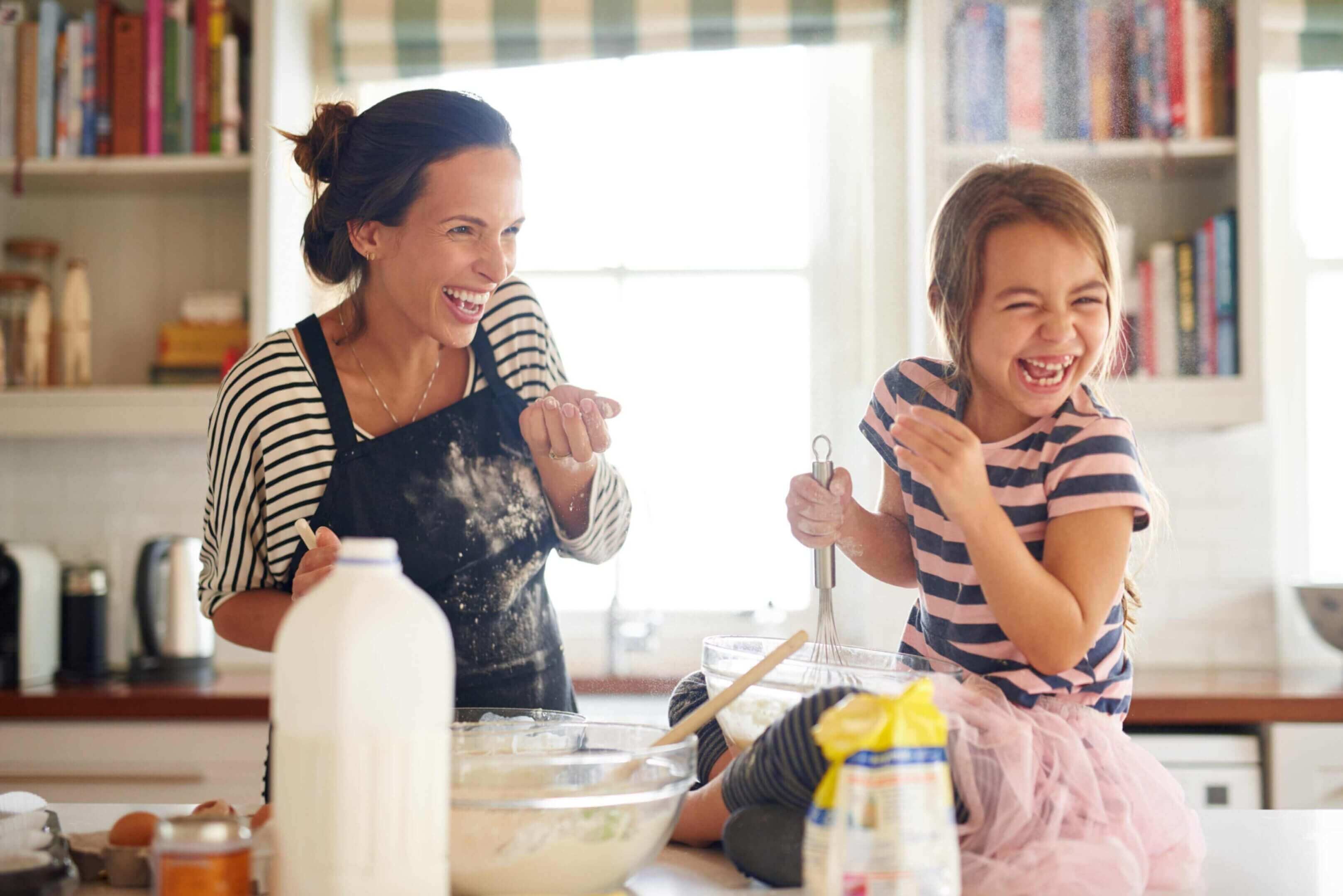 A mom and a child enjoying gluten free baking together.